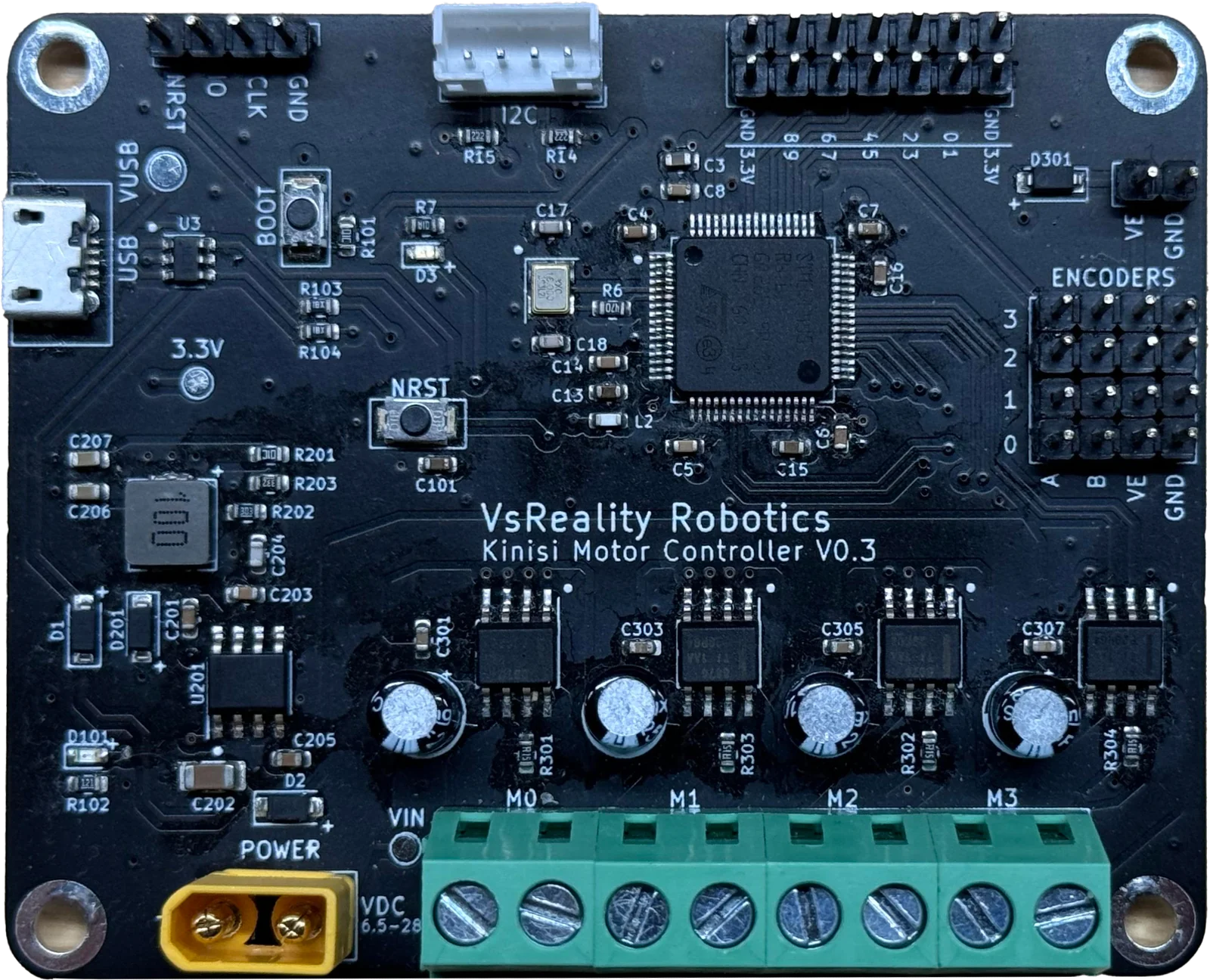 The Kinisi motor controller board, showing four motor terminals, four encoder headers and a USB port